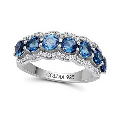 4.0mm London Blue Topaz and White Lab-Created Zircon Scallop Border Seven Stone Ring in Sterling Silver
