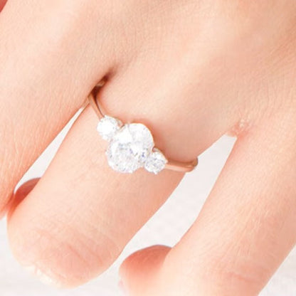 1.25 CT. TW Oval and Round Diamond Three Stone Engagement Ring in 14K White Gold