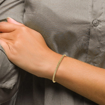 14K Yellow Gold Diamond Cut And Textured With Safety Chain Bangle