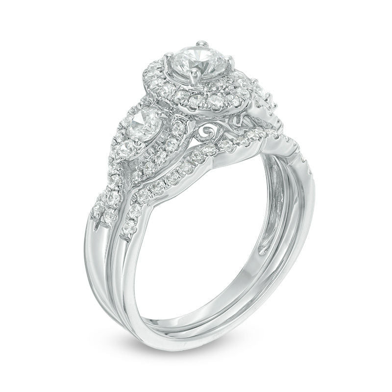 1.15CT. T.W. Diamond Three Stone Oval Frame Twist Halo Bridal Engagement Ring Set in 14K White Gold