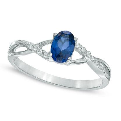 Oval Lab-Created Blue Sapphire and Diamond Accent Twist Engagement Ring in Solid 10K White Gold