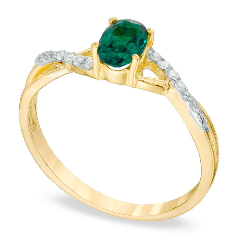 Oval Lab-Created Emerald and Diamond Accent Twist Engagement Ring in Solid 10K Yellow Gold
