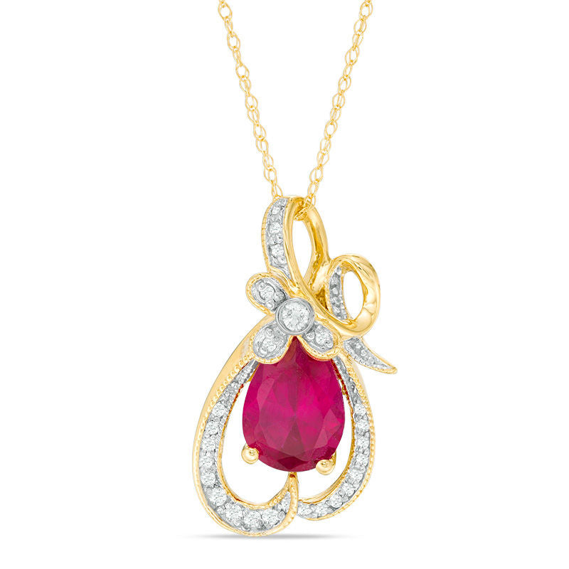 Pear-Shaped Lab-Created Ruby and 0.13 CT. T.W. Diamond Antique Vintage-Style Looping Ribbon Pendant in 10K Yellow Gold