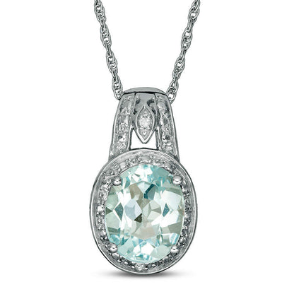 Oval Blue Topaz and Natural Diamond Accent Frame Pendant in Sterling Silver