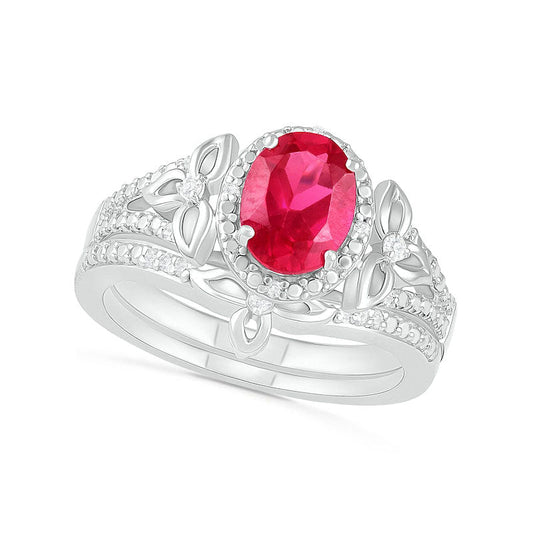 Oval Lab-Created Ruby and 0.07 CT. T.W. Diamond Bead Frame Flower-Sides Split Shank Bridal Engagement Ring Set in Sterling Silver