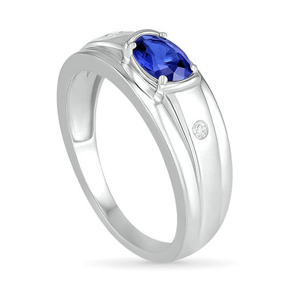 Men's Oval Blue Lab-Created Sapphire and 0.05 CT. T.W. Diamond Duo Stepped Edge Ring in Sterling Silver