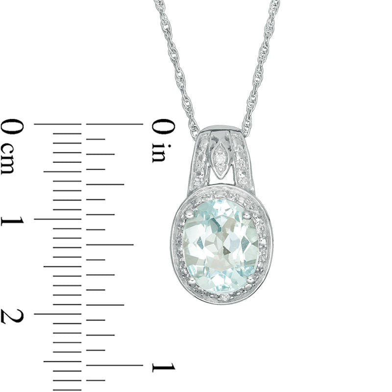 Oval Blue Topaz and Natural Diamond Accent Frame Pendant in Sterling Silver